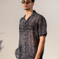 Black geometric silk shirt for men by Stylera, featuring a stylish pattern and relaxed fit