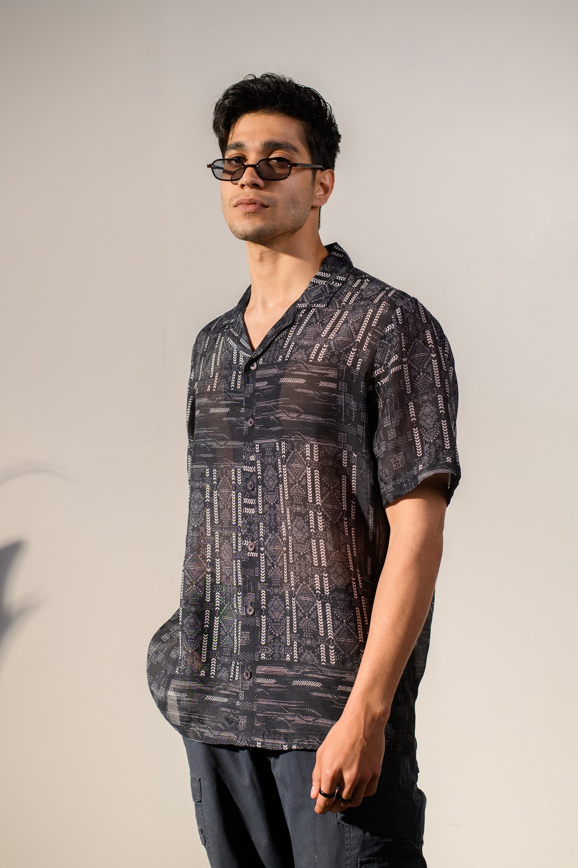 Black geometric silk shirt for men by Stylera, featuring a stylish pattern and relaxed fit