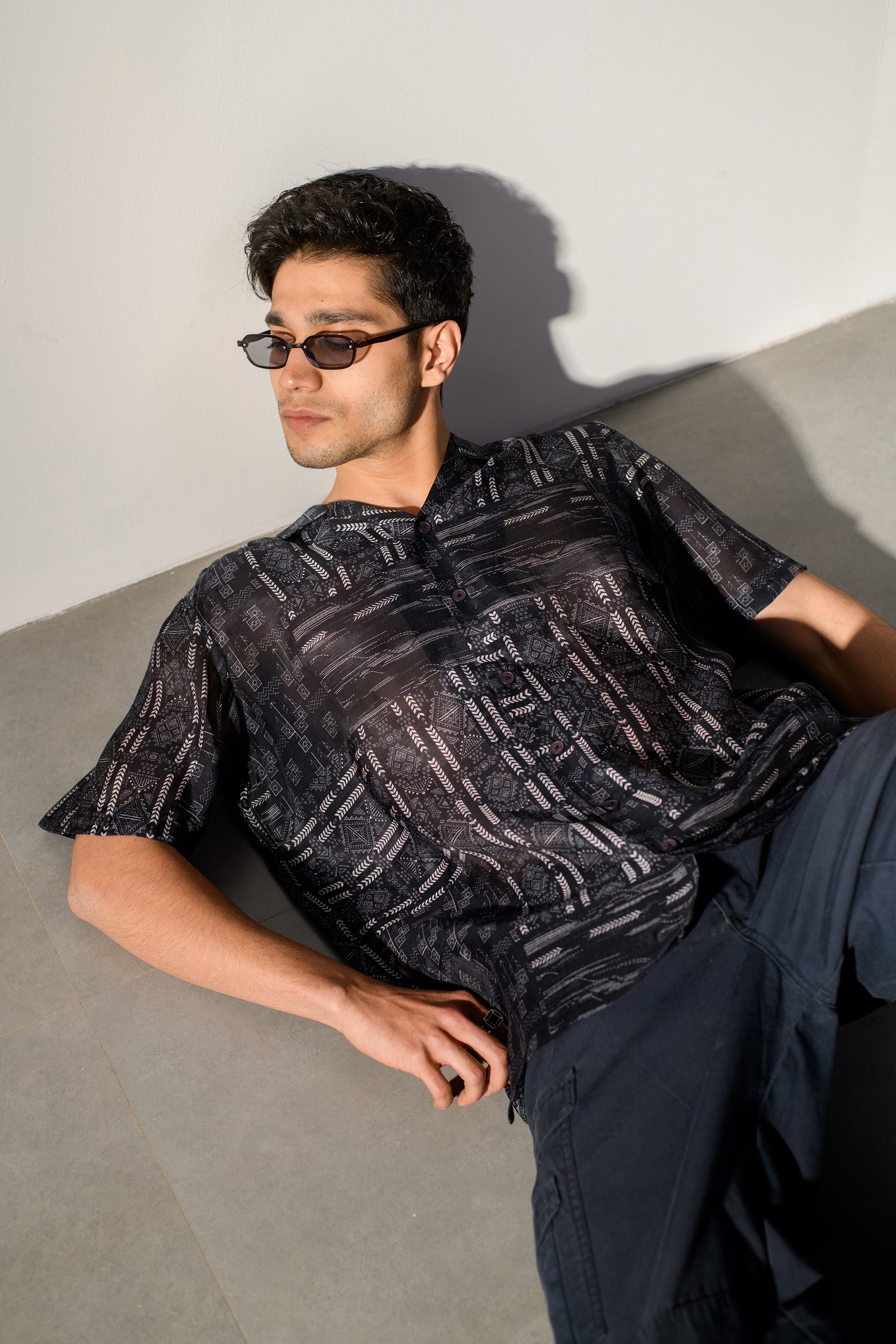 Black geometric silk shirt for men with short sleeves and a relaxed fit, perfect for casual stylish wear