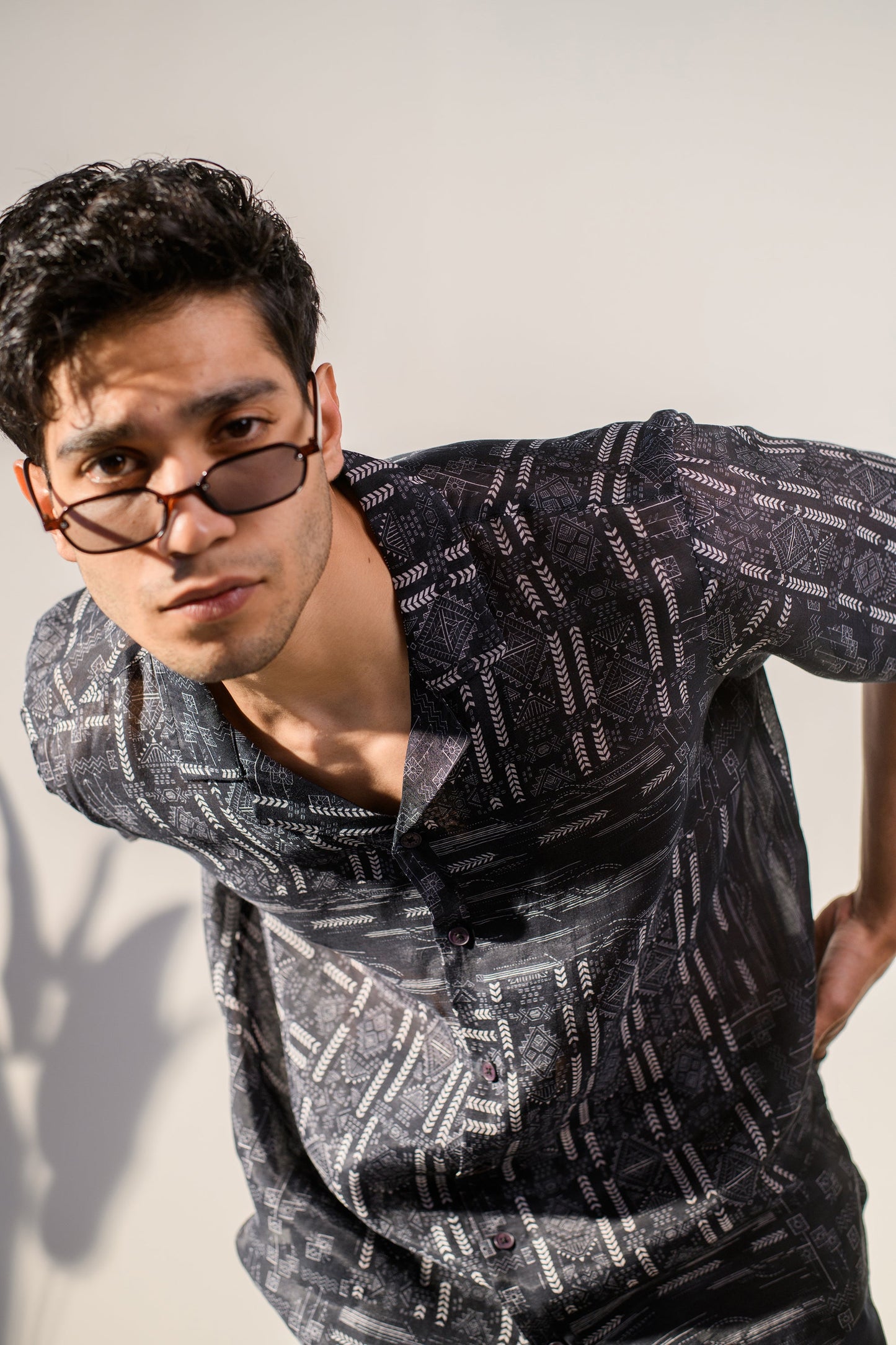 Stylish black geometric silk shirt for men by Stylera, featuring a unique pattern