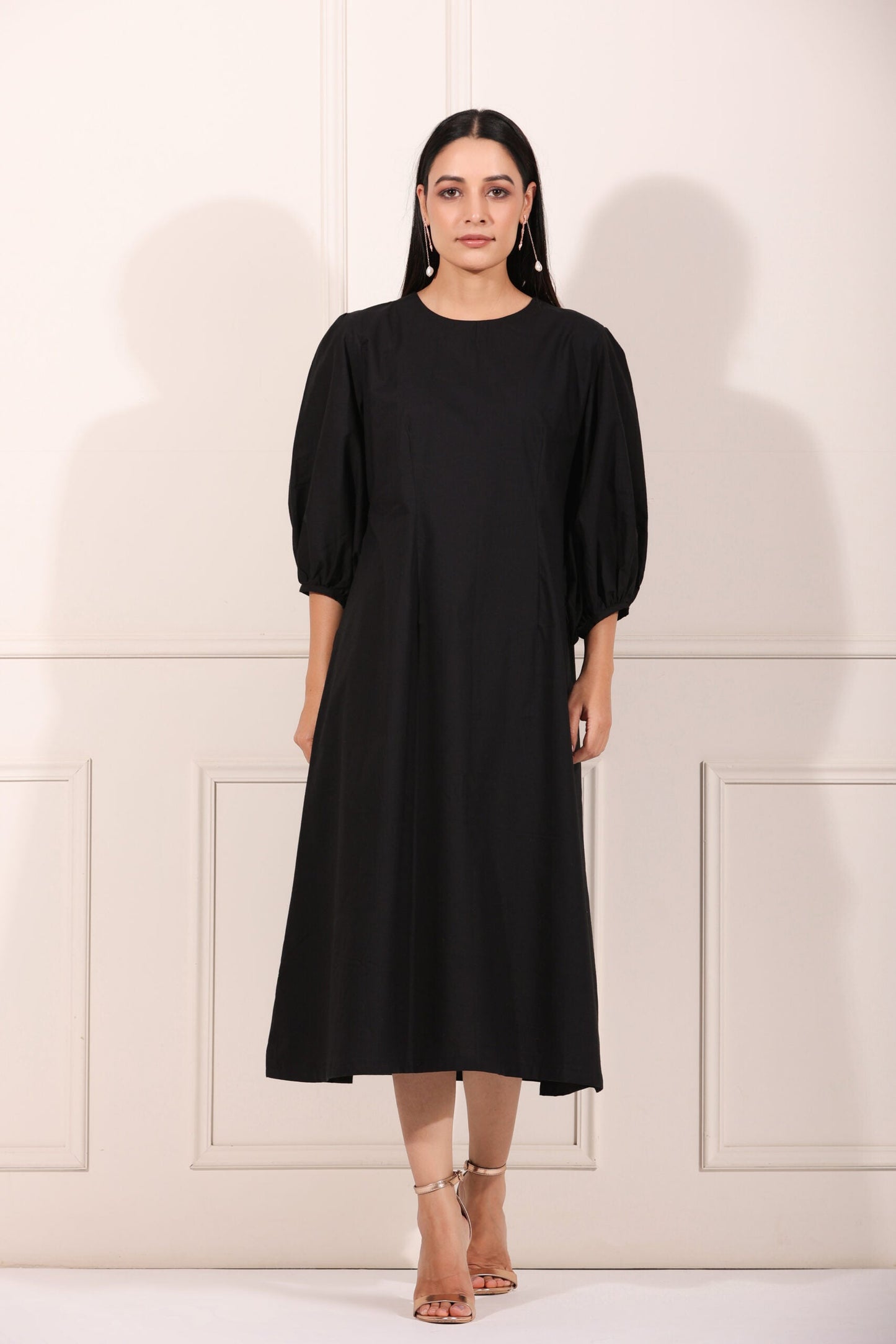 Stylish black midi dress for women with puff sleeves and a flattering silhouette
