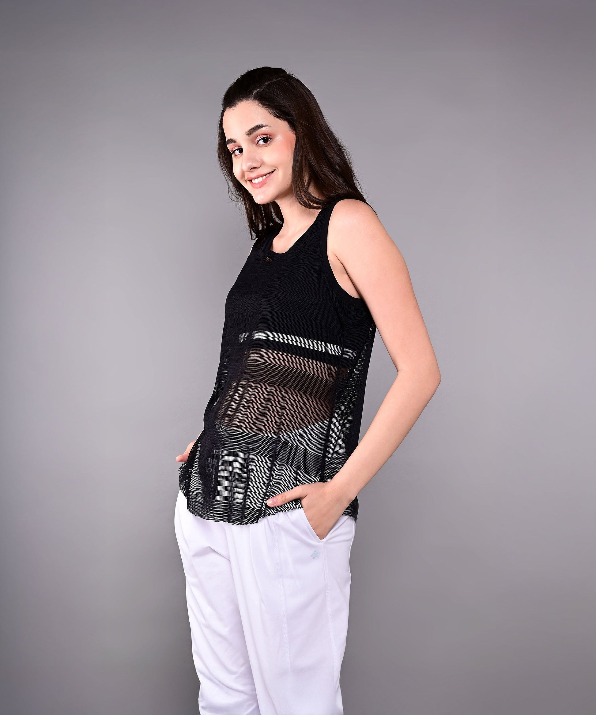 Stylish black netted tank top for women with a relaxed fit and pockets for a trendy look