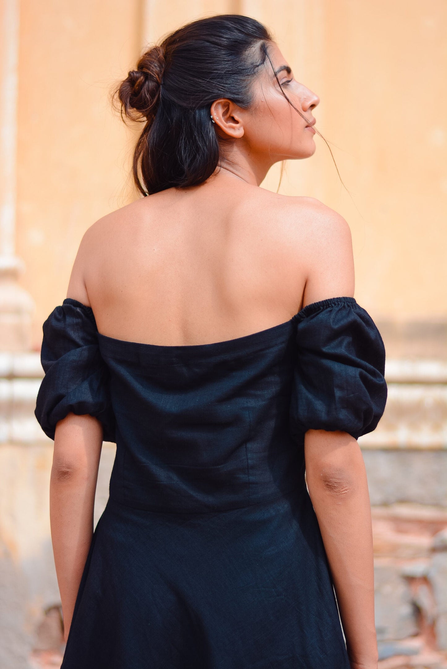 Elegant black off shoulder short dress with puffed sleeves for a stylish look