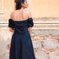 Back view of a black off shoulder short dress with puff sleeves, perfect for casual outings