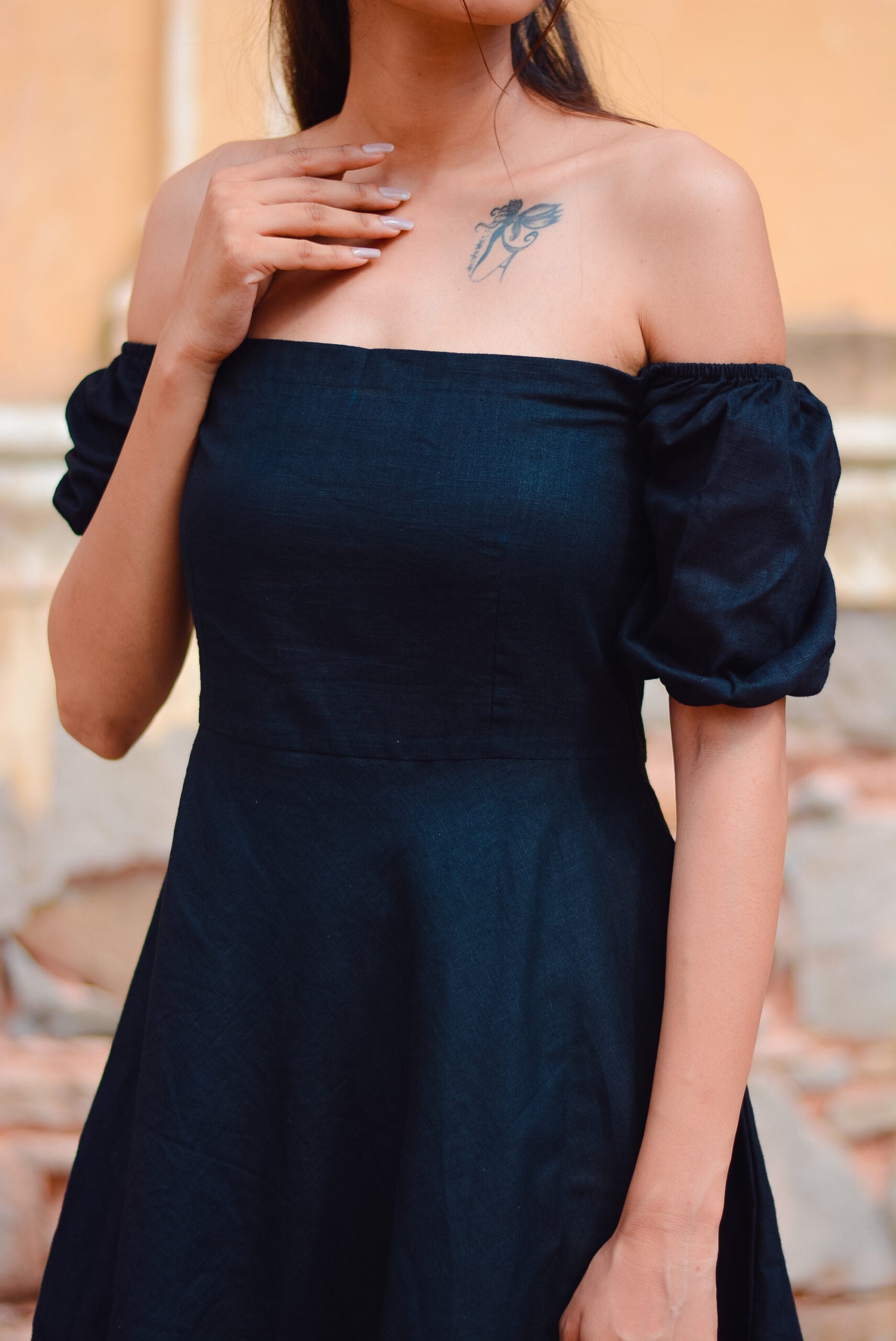 Stylish black off shoulder short dress with puff sleeves for a chic summer look