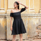 Elegant black off shoulder short dress with puff sleeves, perfect for casual outings or summer events