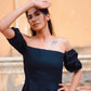 Elegant black off shoulder short dress featuring puff sleeves and a fitted bodice