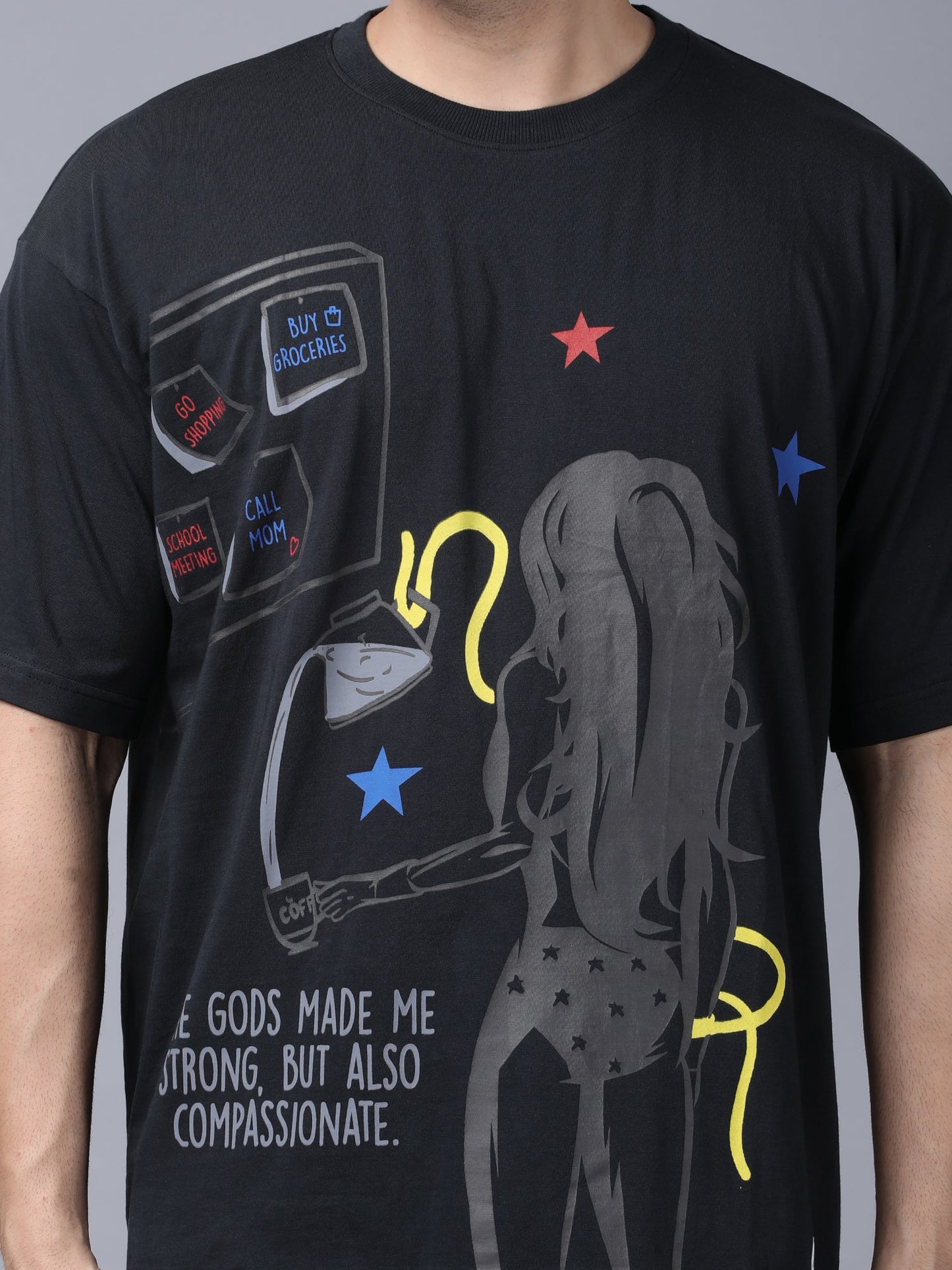 Stylstpls black oversized crew neck t-shirt featuring a graphic design of a strong woman