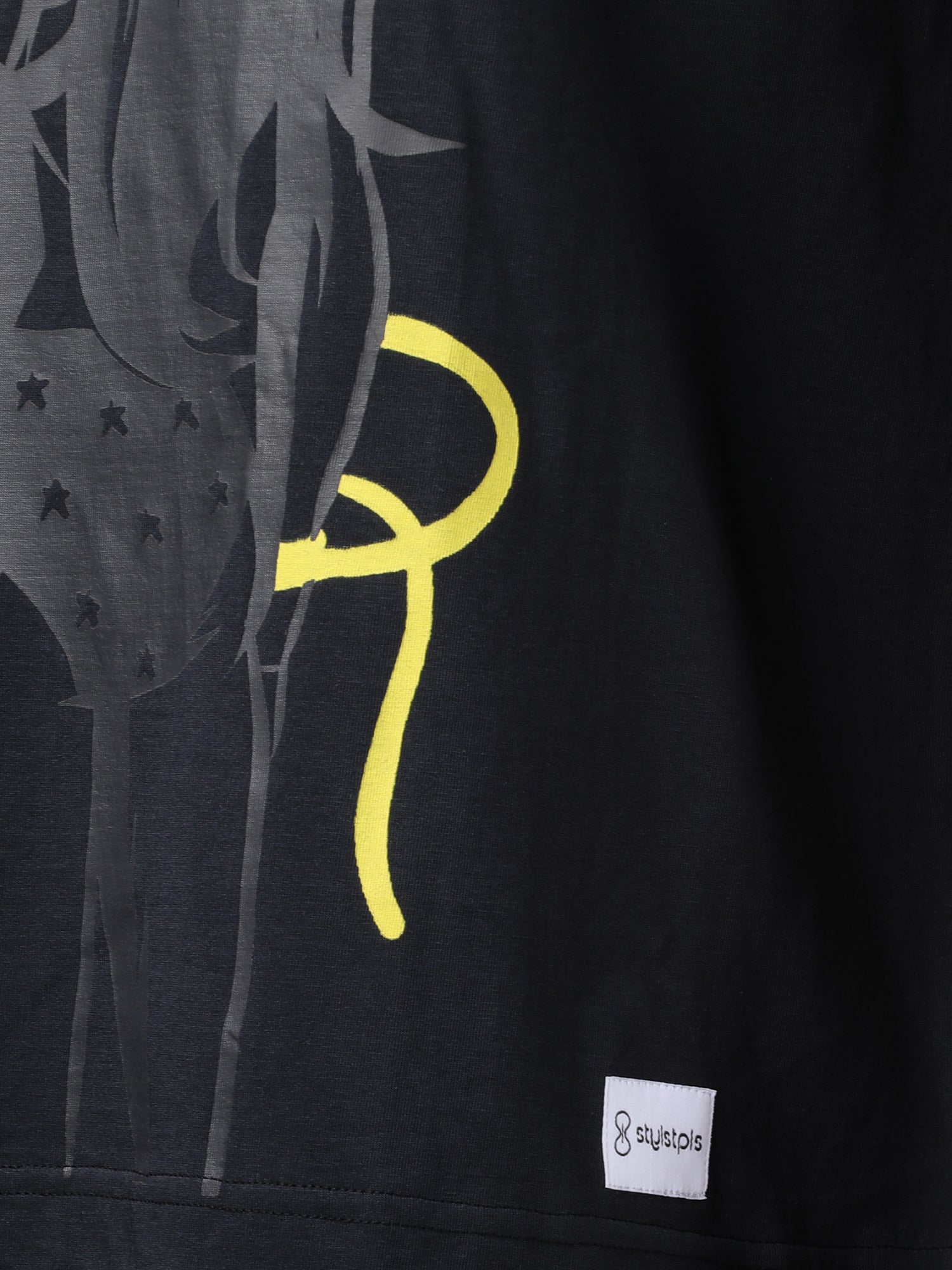 Stylstpls black oversized crew neck t-shirt featuring a unique graphic design on the front