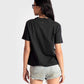 Back view of a woman wearing a black print t-shirt for women paired with denim shorts