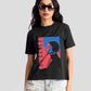 Stylera black print t-shirt for women with colorful graphic worn with denim shorts