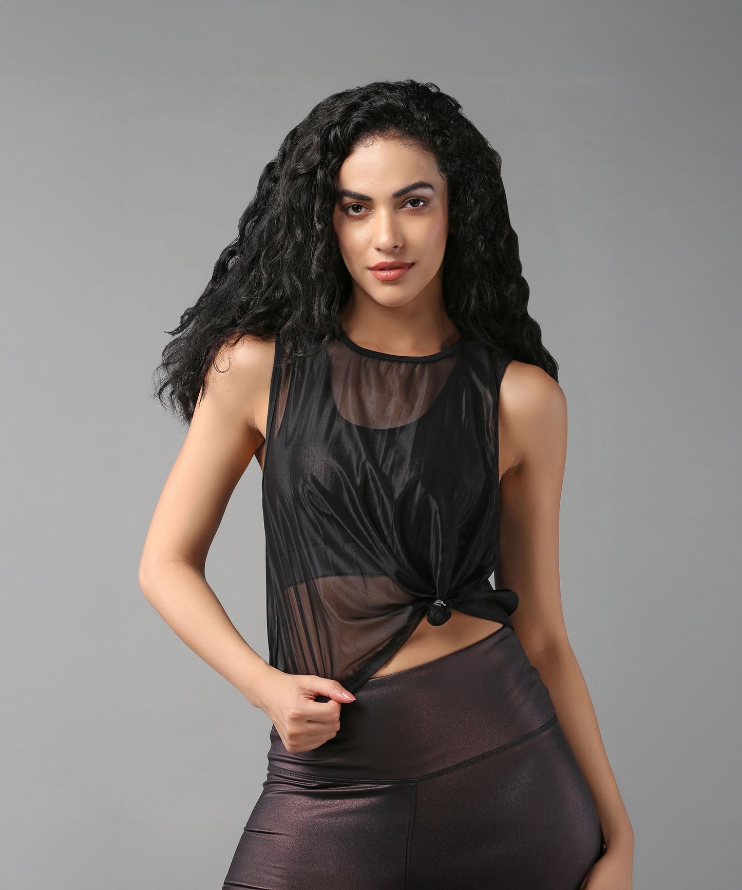 Stylish black sheer top for women with knotted detail, perfect for layering and casual wear