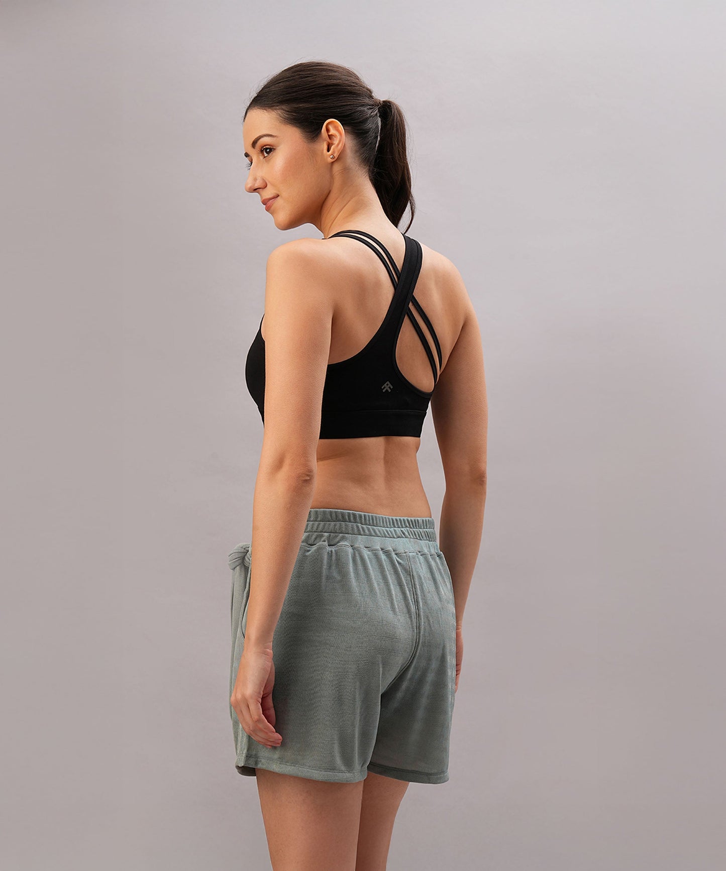 Elegant black sports bra for women with stylish cross-back design and comfortable fit