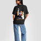 Black streetwear oversized tee womens by Stylera with graphic print on back paired with blue jeans