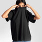 Black streetwear oversized tee womens by Stylera worn by model with sunglasses on head