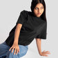 Stylera black streetwear oversized tee womens styled with blue jeans and sunglasses