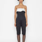 Stylera black swan inspired fashion top with strapless white and black design worn with black pants