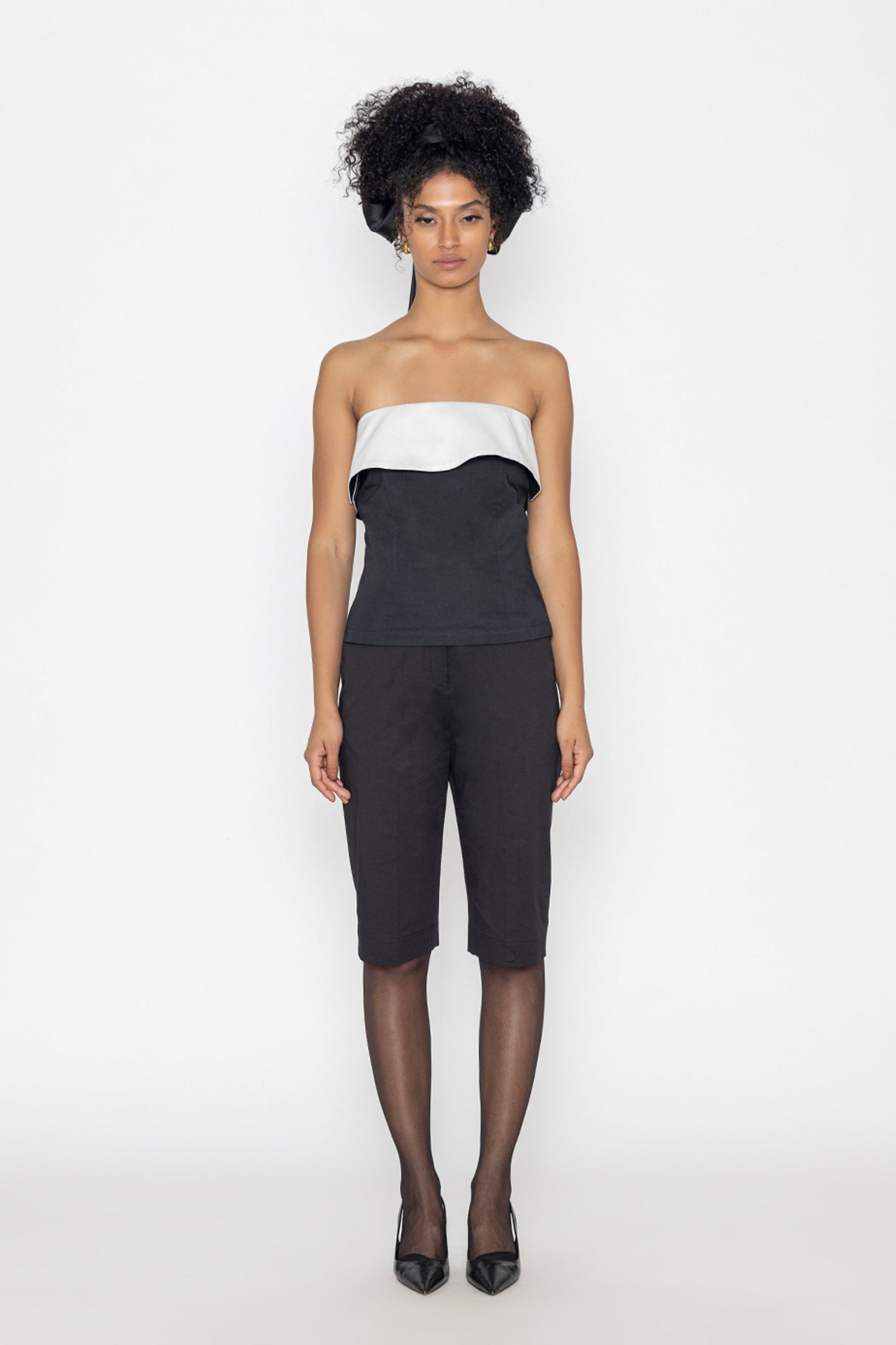 Stylera black swan inspired fashion top with strapless white and black design worn with black pants