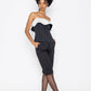 Woman wearing black swan inspired fashion top by Stylera paired with black pants and heels