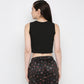 Back view of a black twisted crop top from Stylera, perfect for casual or athletic wear