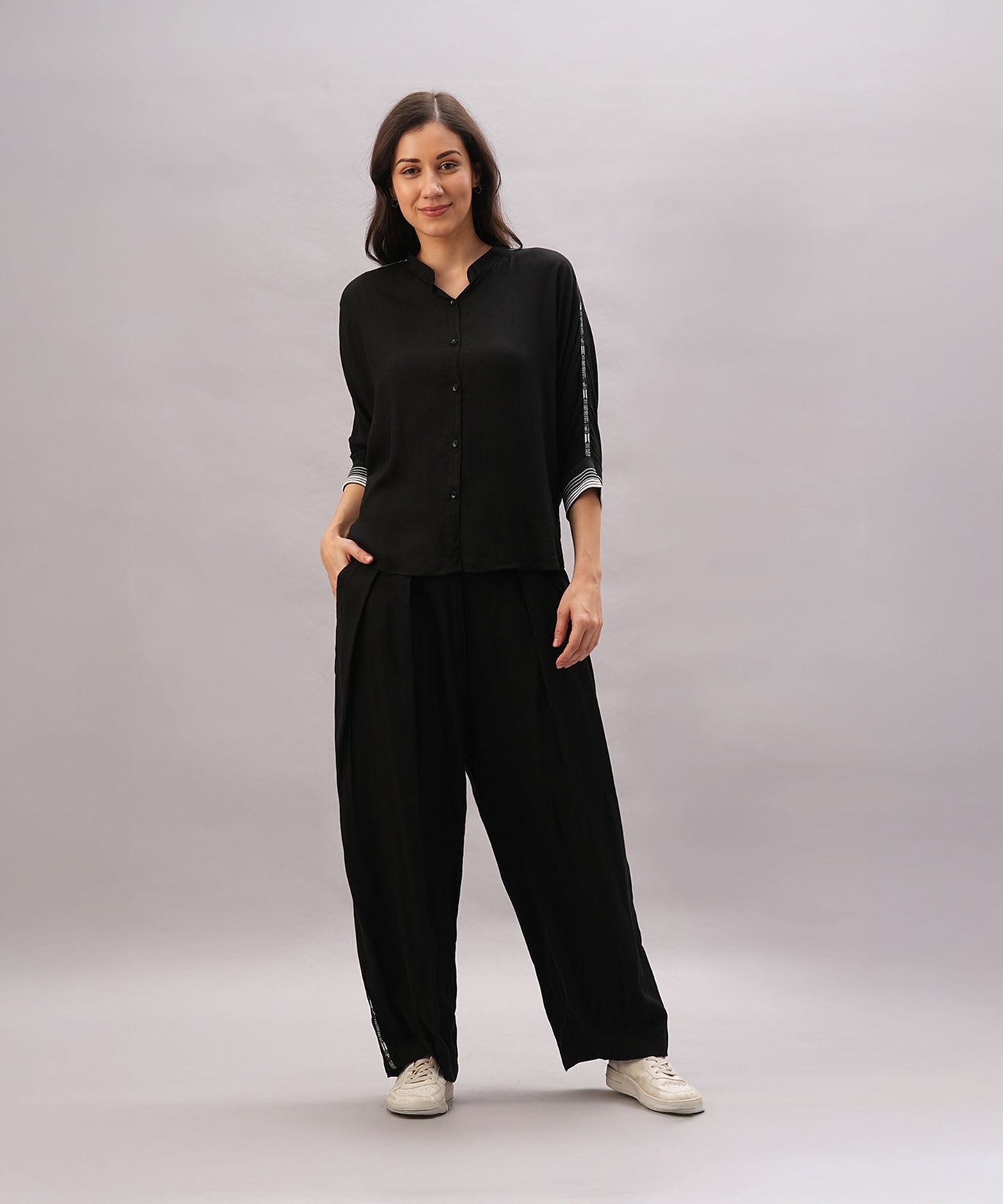 Stylish black two piece lounge set women with button-up top and relaxed fit pants