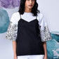 Stylera black white layered top with floral print bell sleeves worn with white shorts