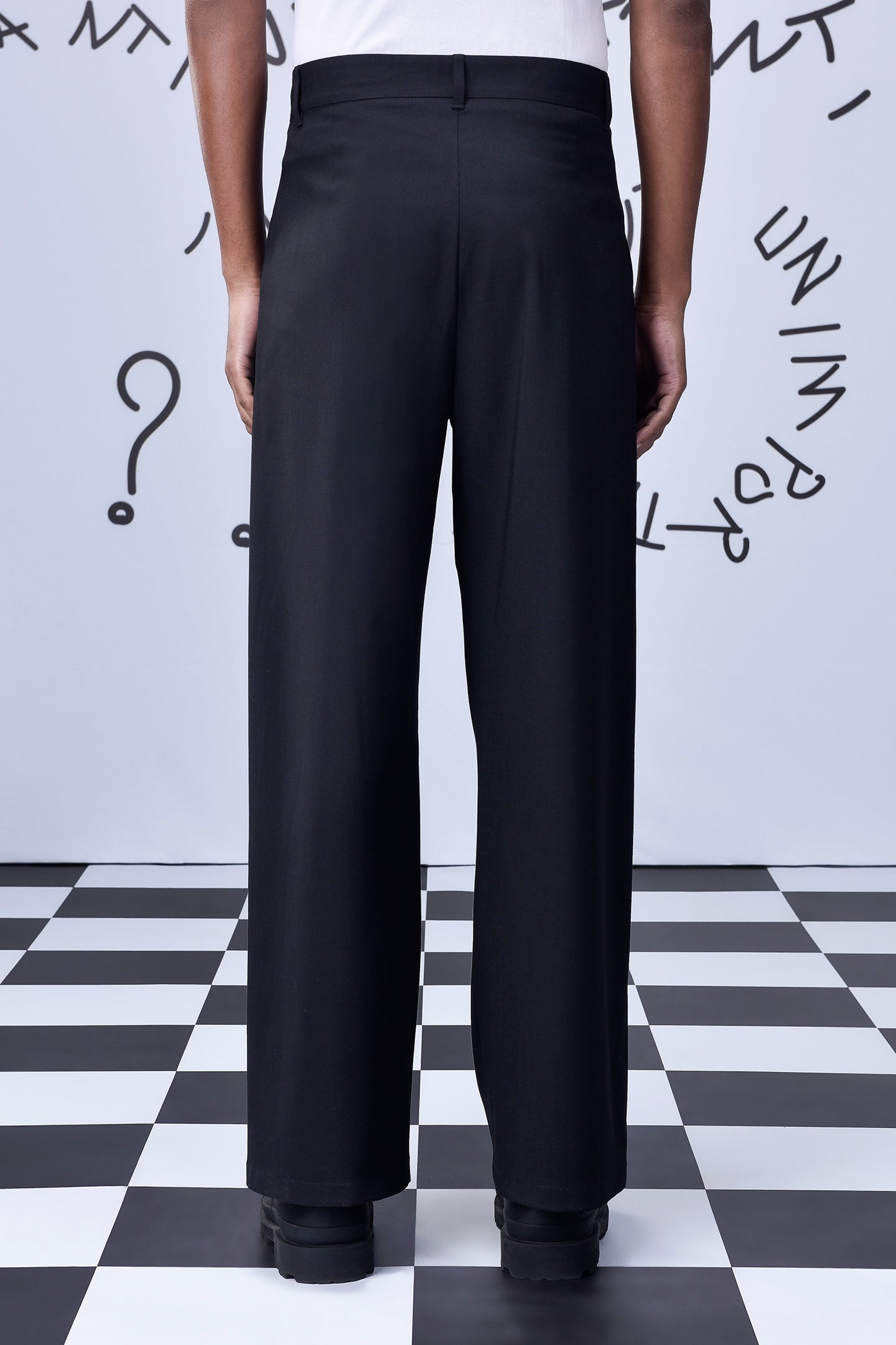 Stylera black wool straight fit trousers back view on model with straight legs