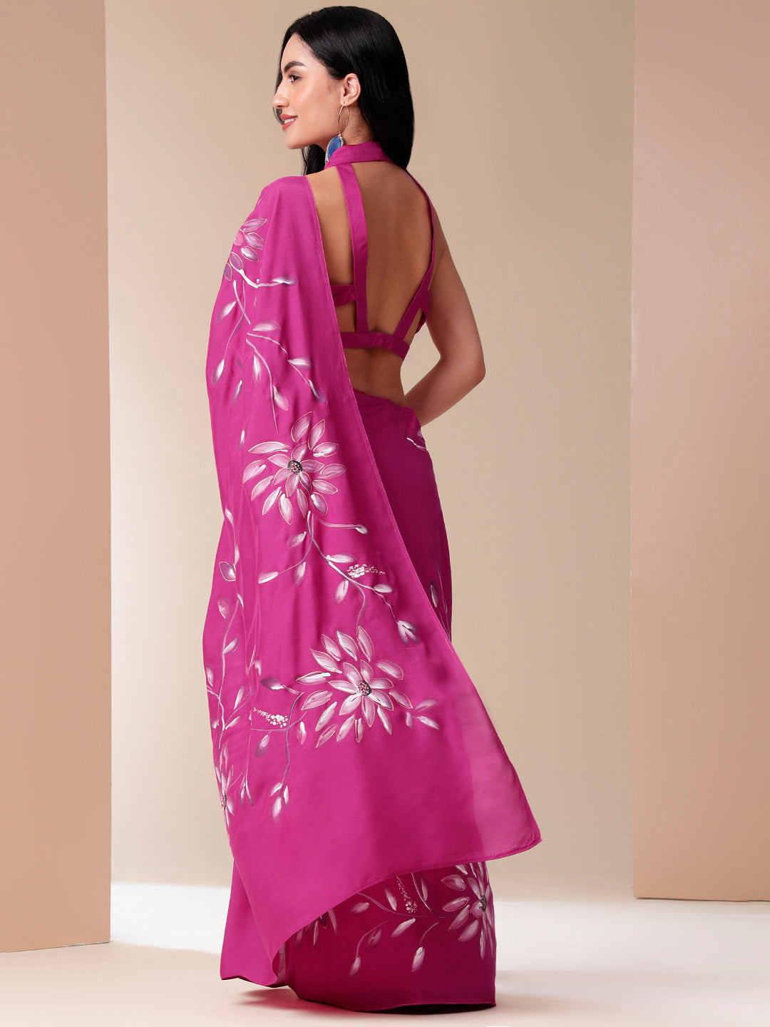 Blissful brush pink silk saree featuring floral designs and a stylish drape for elegant occasions