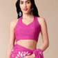 Model wearing a blissful brush pink silk saree paired with a matching halter neck blouse