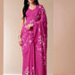 Stylera blissful brush pink silk saree featuring elegant floral designs and a graceful drape