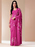 Stylera blissful brush pink silk saree featuring elegant floral designs and a graceful drape