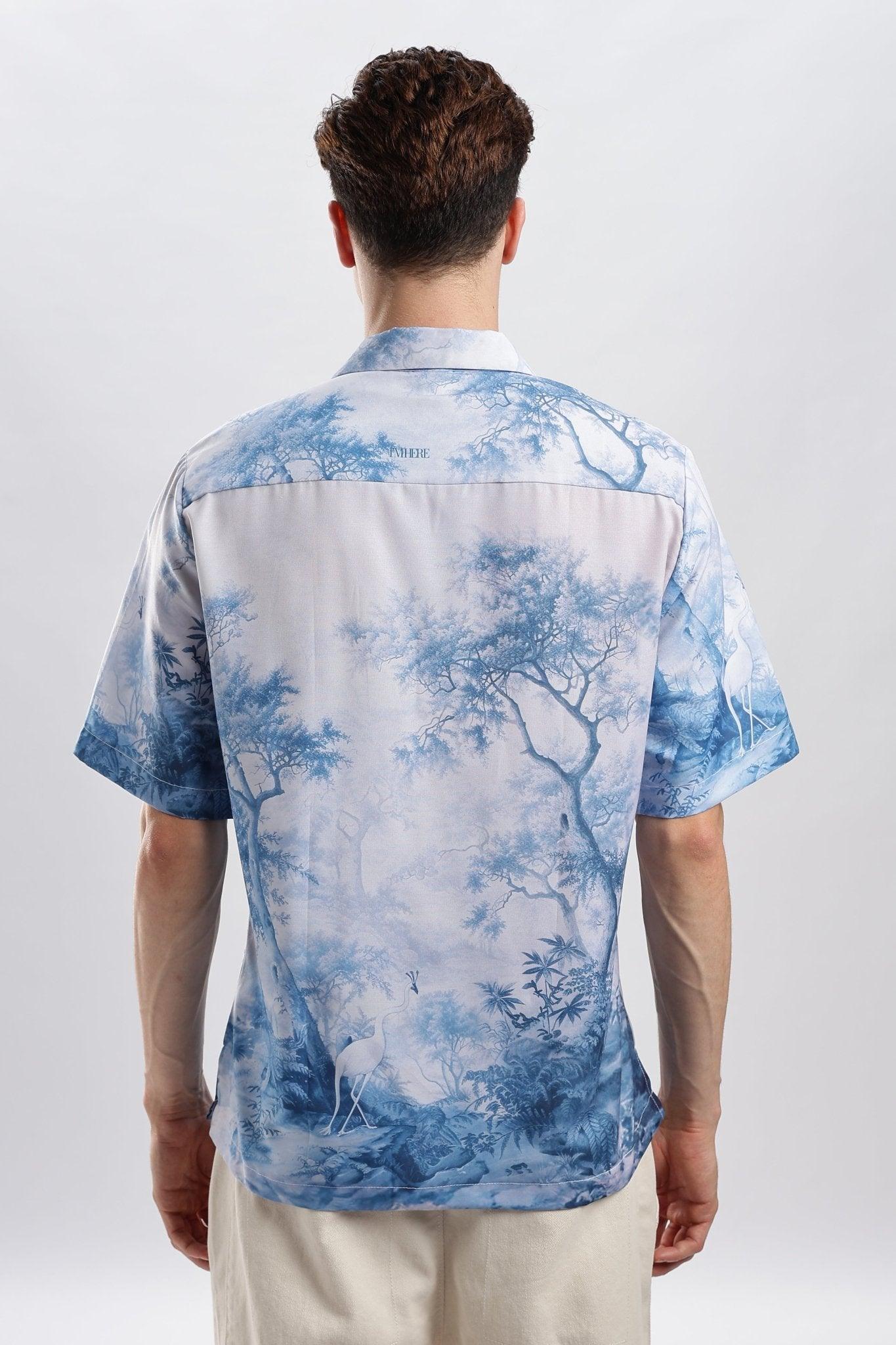 Back view of man wearing Stylera blue and white printed casual shirt short sleeve button down relaxed fit