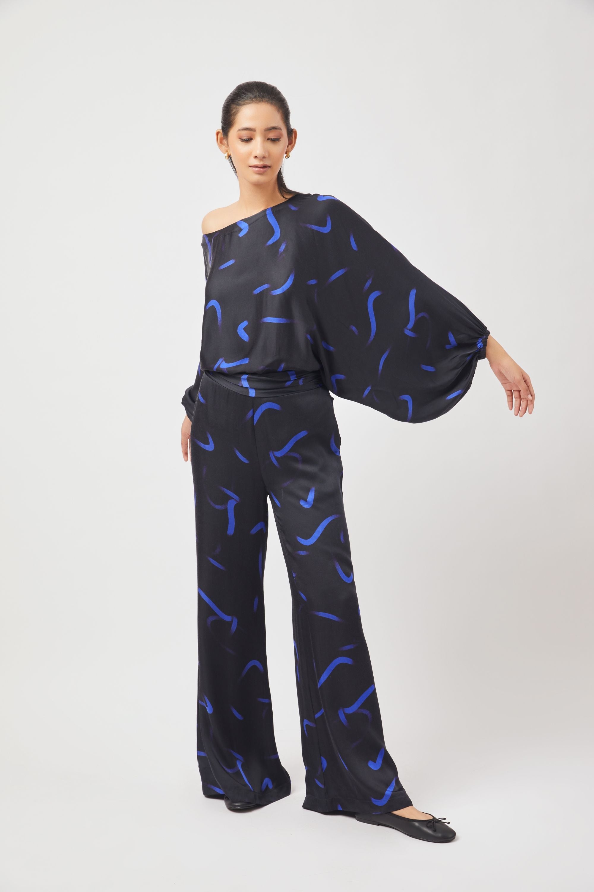 Stylera blue black print two piece set featuring off-shoulder top with wide sleeves and matching pants