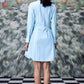 Back view of model in Stylera blue green stripe dress long sleeve belted shirt dress