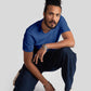 Man wearing blue jacquard regular fit t-shirt by Stylera paired with dark pants and white sneakers