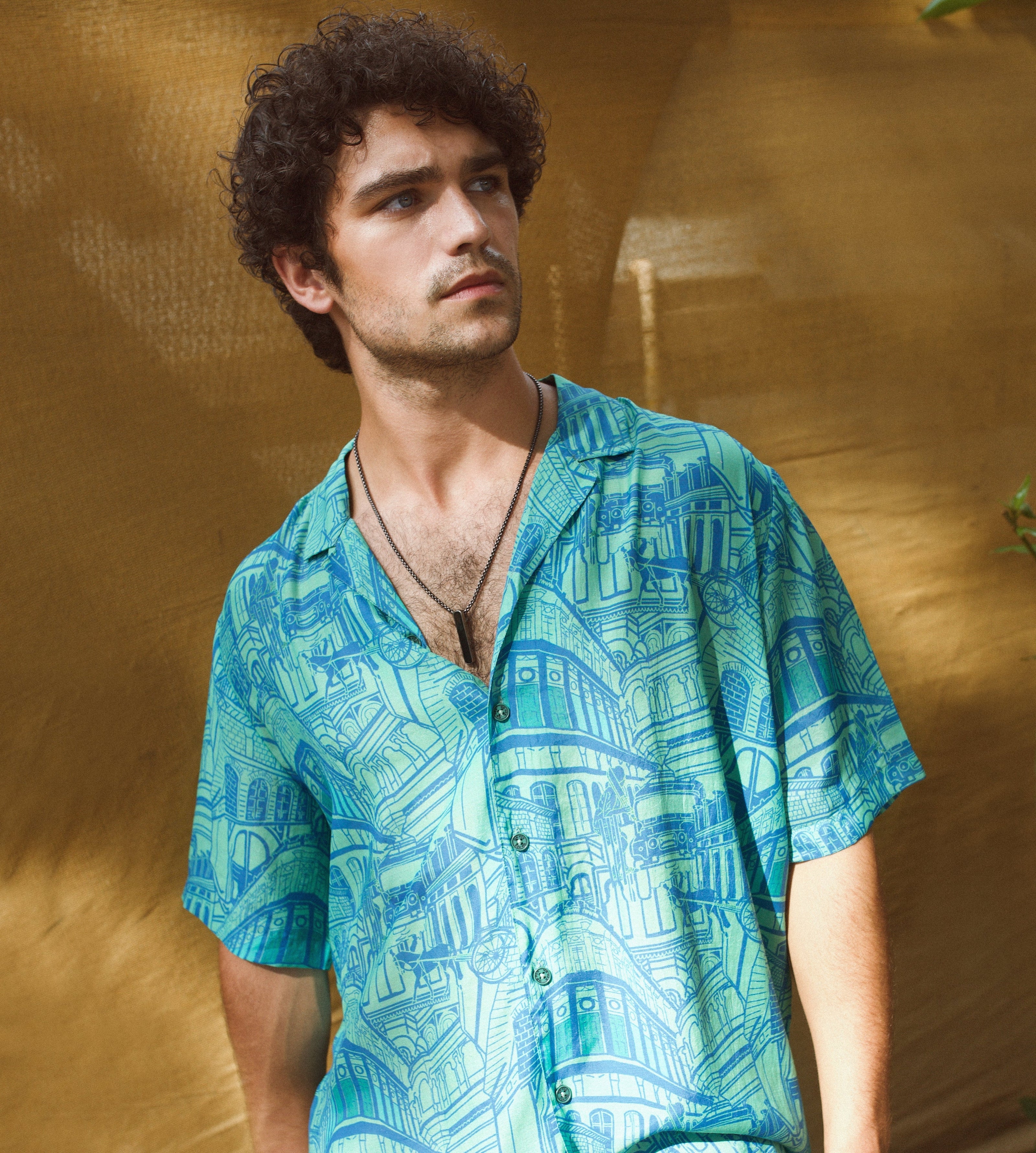 Stylish blue oversize shirt for men with vibrant graphic print, perfect for casual outings