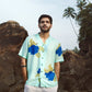 Blue oversized shirt for men with vibrant floral print, perfect for casual summer outings