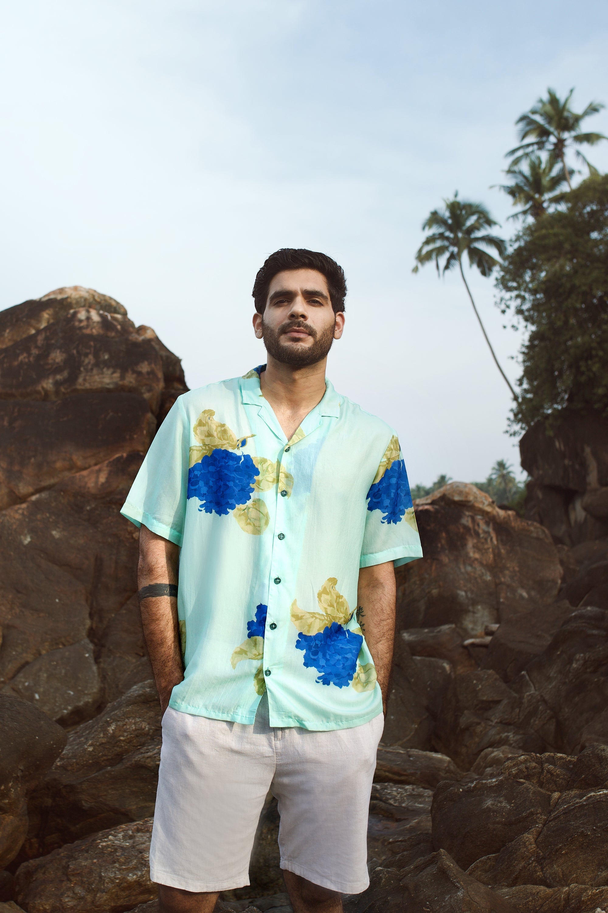 Blue oversized shirt for men with vibrant floral print, perfect for casual summer outings