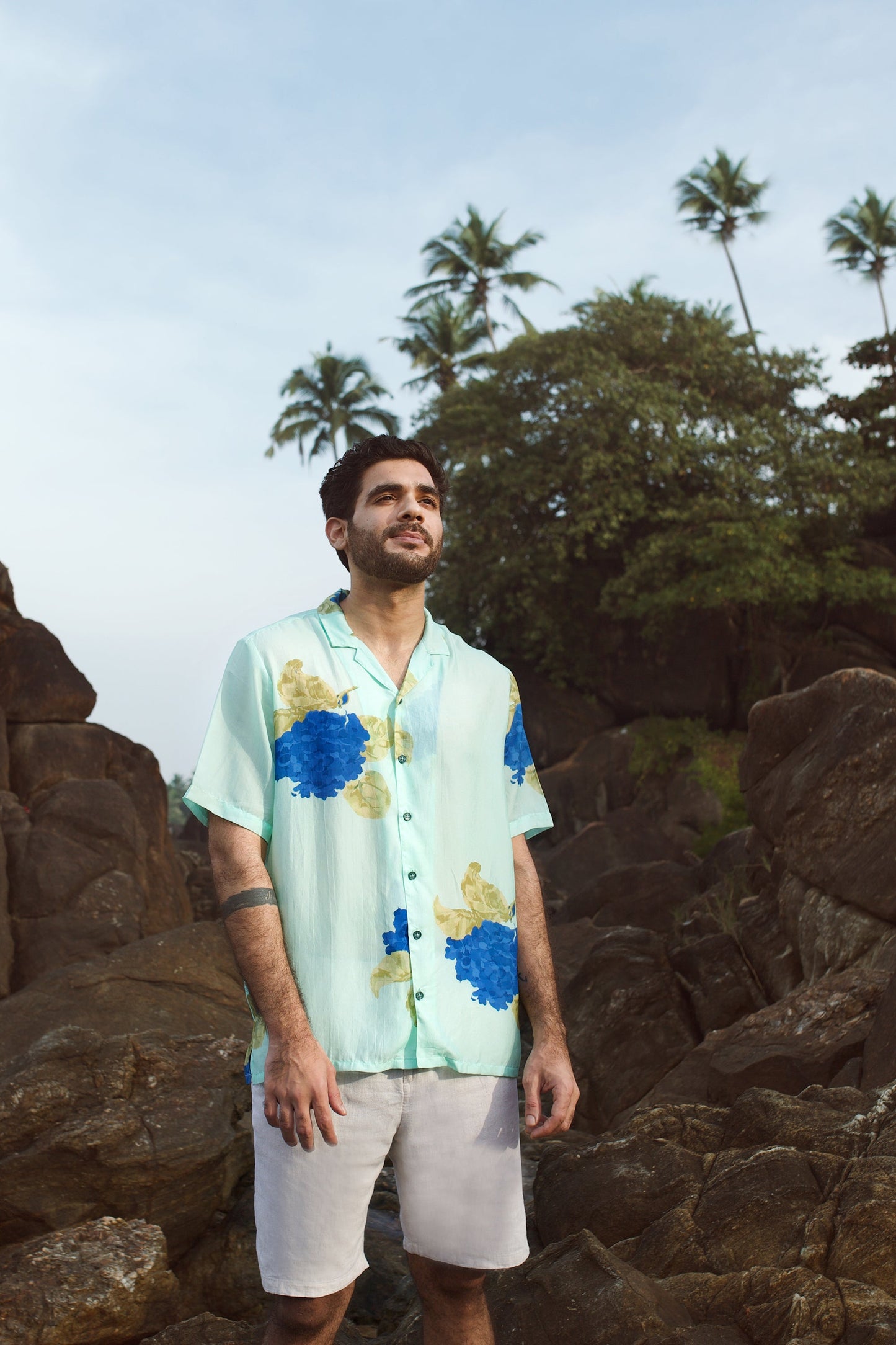 Casual blue oversized shirt for men with floral design, perfect for warm weather outings