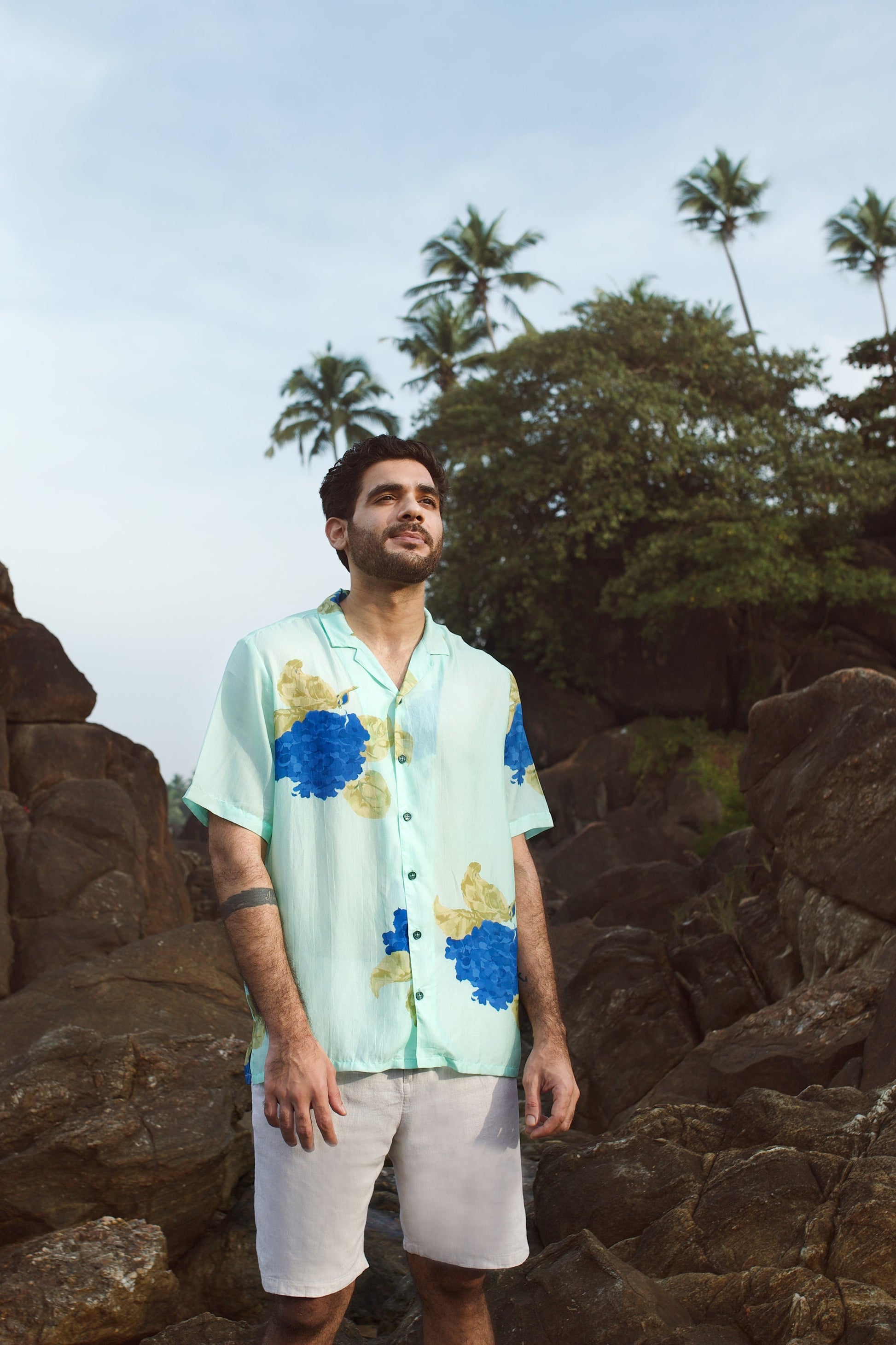 Casual blue oversized shirt for men with floral design, perfect for warm weather outings