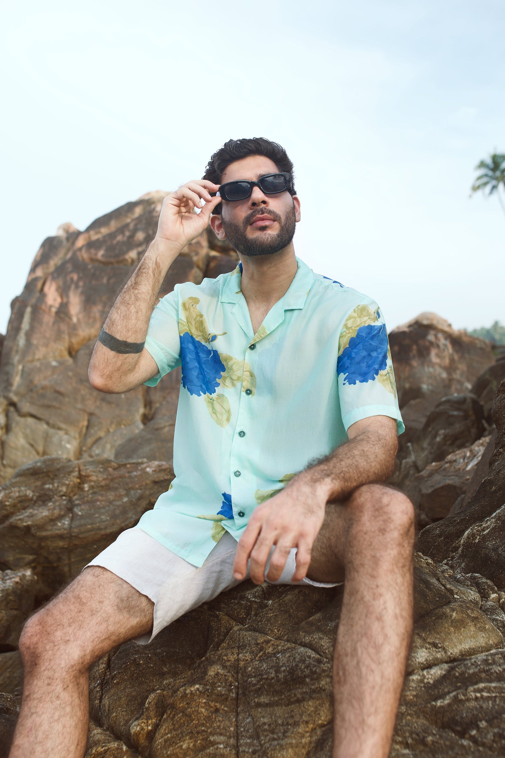 Blue oversized shirt for men featuring a floral design, perfect for casual summer outings