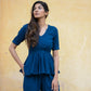 Model wearing a Yale blue peplum co-ord set with a stylish design and relaxed fit