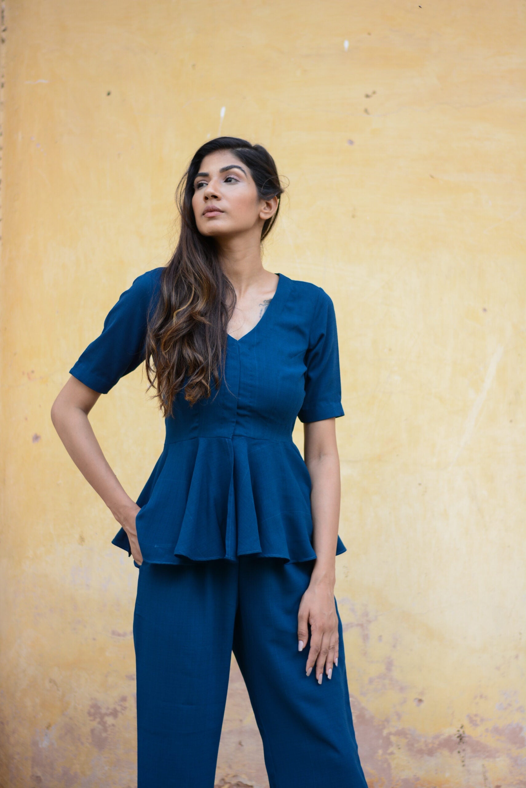 Model wearing a Yale blue peplum co-ord set with a stylish design and relaxed fit