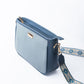 Stylish blue sling bag for women with an elegant design and decorative strap