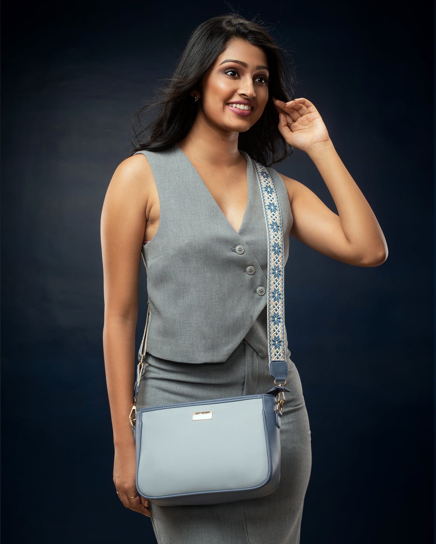 Stylish blue sling bag for women with adjustable strap, perfect for everyday use.