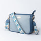 Stylish blue sling bag for women with a patterned strap, perfect for everyday use