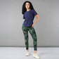 Stylish model wearing a blue soft t-shirt for women paired with green camo leggings