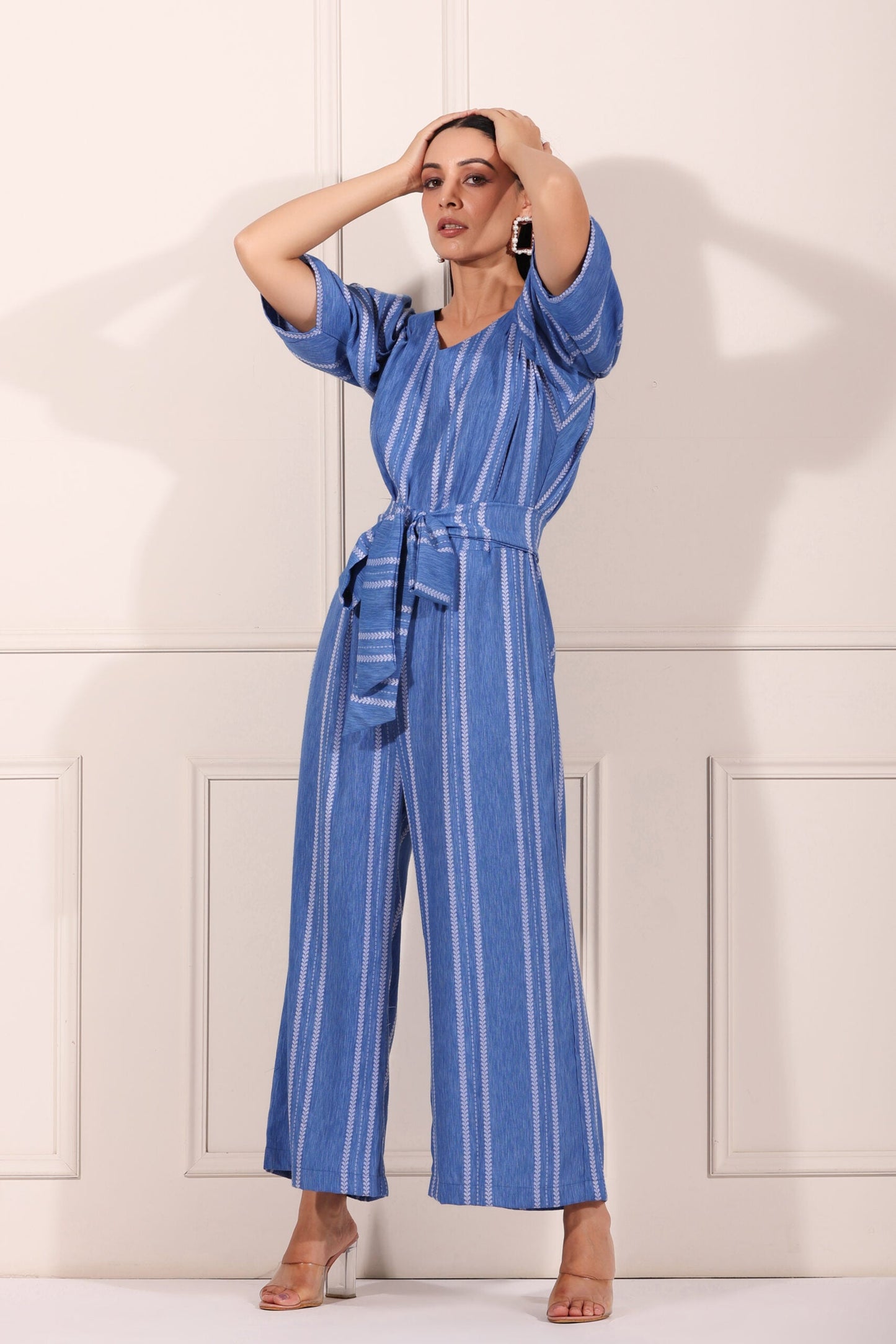 Blue striped jumpsuit for women with wide sleeves and tie belt, perfect for casual outings