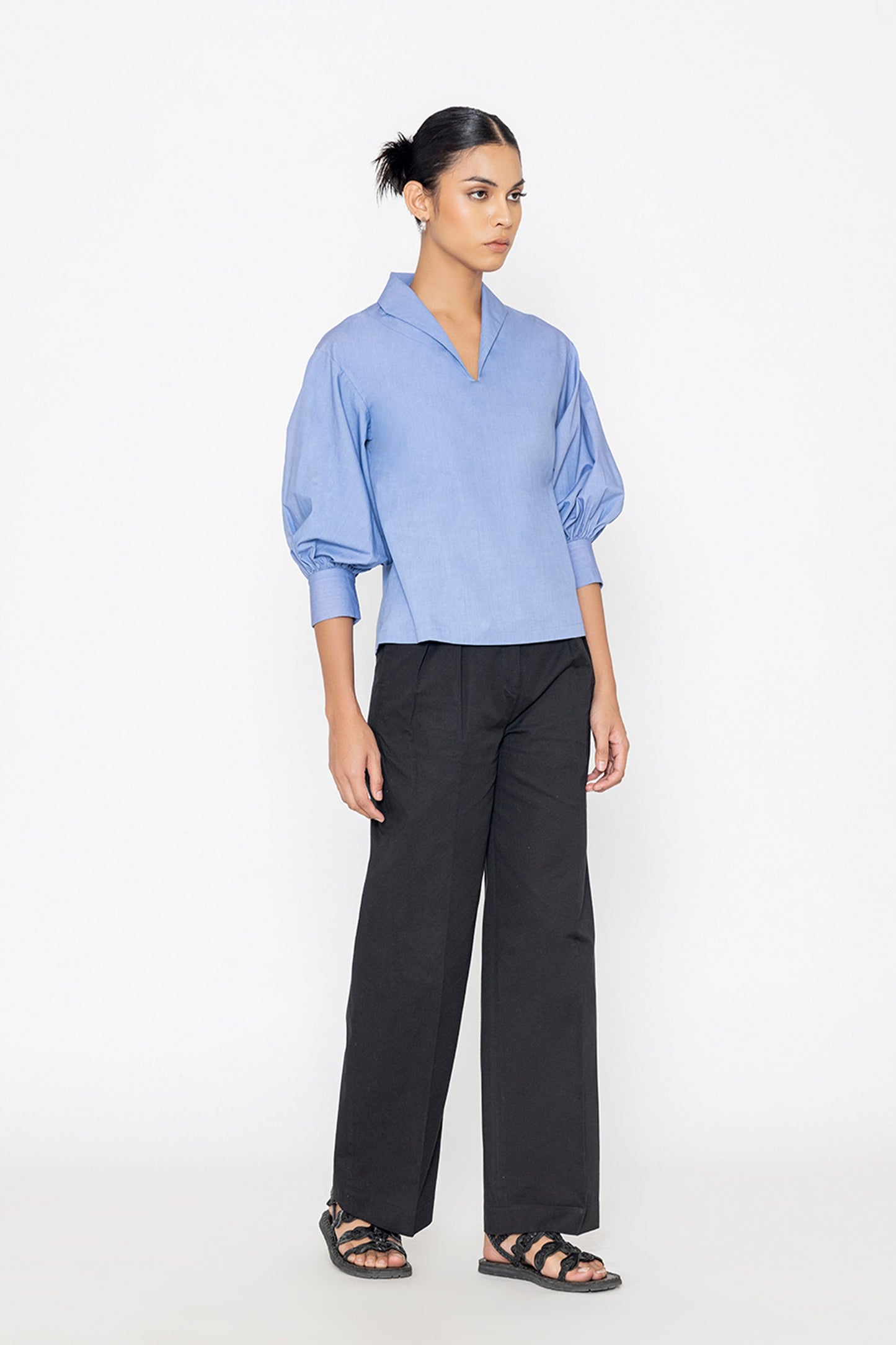 Stylera blue v neck blouse with puff sleeves paired with black wide leg pants