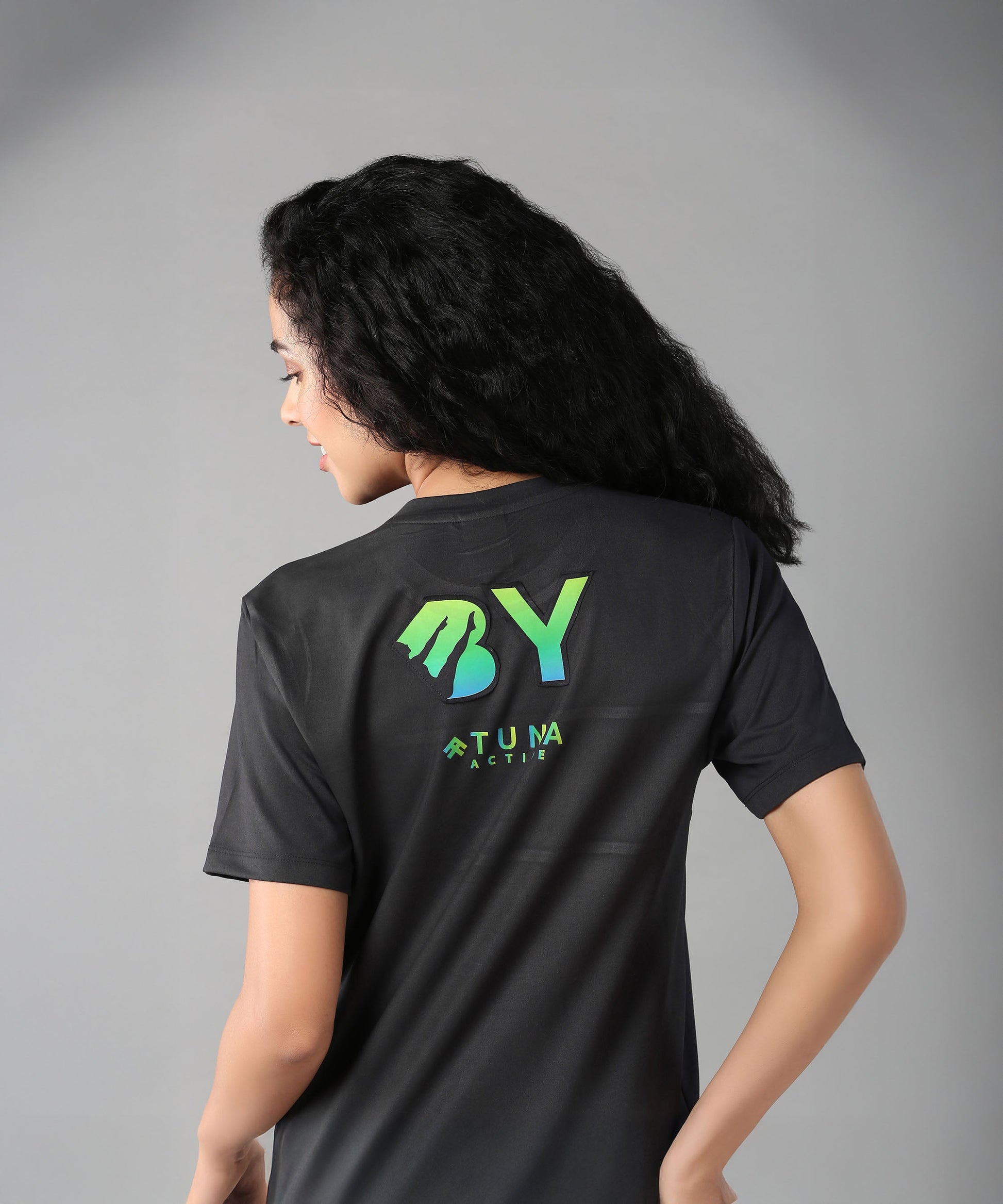 Women's black shirt from Stylera promoting body positivity clothing for women with vibrant graphics